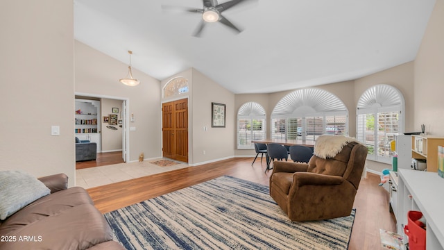 116 E Mountain Sky Ave, Phoenix, AZ 85048 - living area featuring wood finished floors, a ceiling fan, plenty of natural light, and high vaulted ceiling