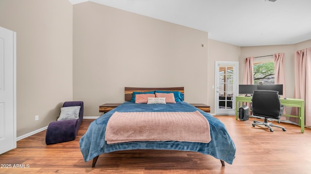 116 E Mountain Sky Ave, Phoenix, AZ 85048 - bedroom featuring wood finished floors, lofted ceiling, and an office area