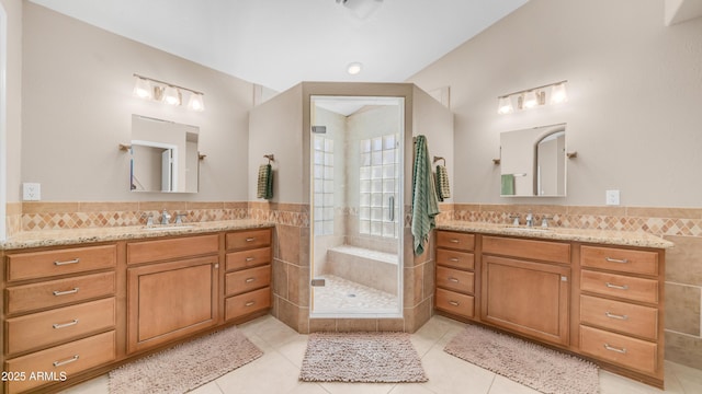 116 E Mountain Sky Ave, Phoenix, AZ 85048 - full bath featuring tile walls, tile patterned floors, vanity, a stall shower, and a wainscoted wall