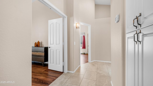 116 E Mountain Sky Ave, Phoenix, AZ 85048 - hall with light tile patterned floors and baseboards