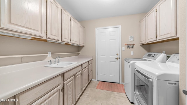 116 E Mountain Sky Ave, Phoenix, AZ 85048 - laundry area featuring separate washer and dryer, cabinet space, and light tile patterned flooring