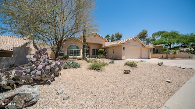 116 E Mountain Sky Ave, Phoenix, AZ 85048 - view of front of property with an attached garage, stucco siding, concrete driveway, and a tile roof