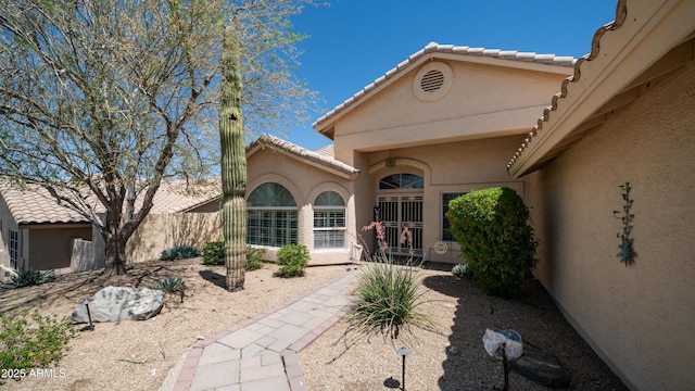 116 E Mountain Sky Ave, Phoenix, AZ 85048 - property entrance featuring stucco siding and a tile roof