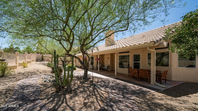 116 E Mountain Sky Ave, Phoenix, AZ 85048 - back of house featuring a chimney, a tile roof, a patio area, and a fenced backyard