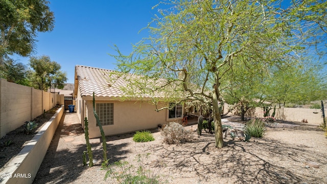 116 E Mountain Sky Ave, Phoenix, AZ 85048 - back of property featuring stucco siding, a tiled roof, and a fenced backyard