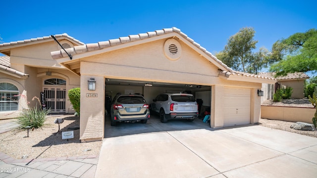 116 E Mountain Sky Ave, Phoenix, AZ 85048 - view of front of property with driveway, an attached garage, stucco siding, and a tile roof