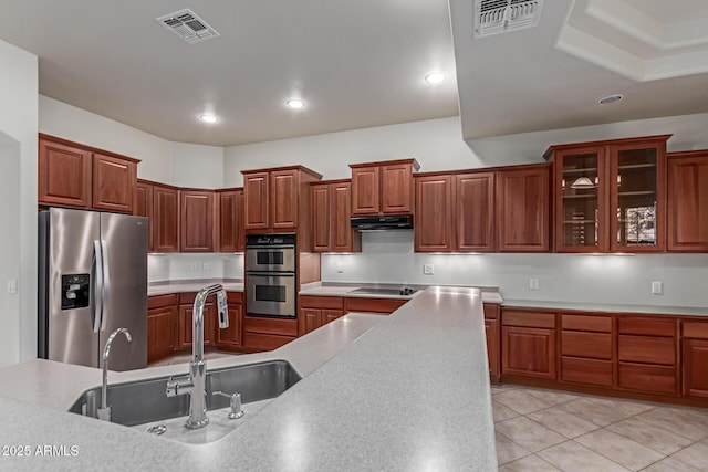 13007 W Tuckey Ct, Glendale, AZ 85307 - kitchen featuring stainless steel appliances, under cabinet range hood, a sink, light countertops, and recessed lighting