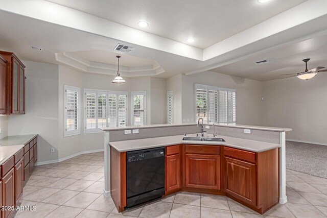13007 W Tuckey Ct, Glendale, AZ 85307 - kitchen with black dishwasher, a sink, a raised ceiling, open floor plan, and light countertops
