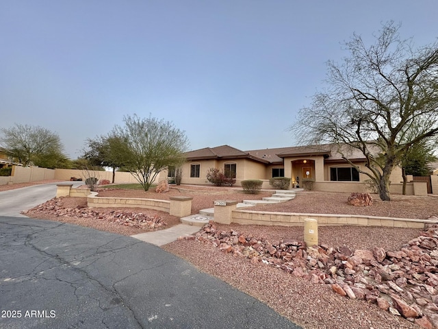 13007 W Tuckey Ct, Glendale, AZ 85307 - view of front of house featuring stucco siding and fence
