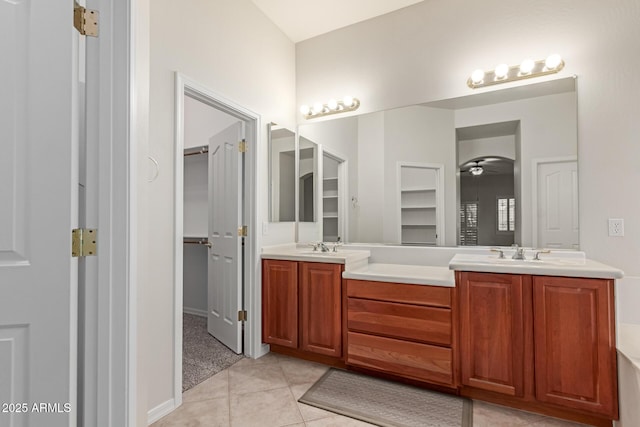 13007 W Tuckey Ct, Glendale, AZ 85307 - bathroom featuring double vanity, a ceiling fan, a spacious closet, and tile patterned floors