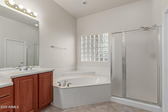 13007 W Tuckey Ct, Glendale, AZ 85307 - bathroom featuring a shower stall, a garden tub, vanity, and tile patterned floors