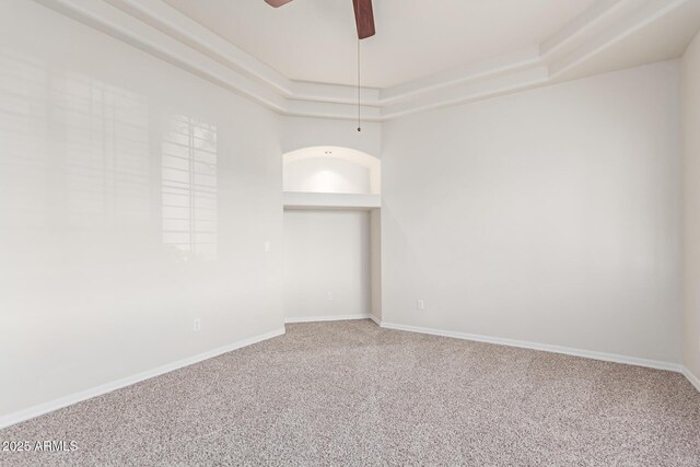 13007 W Tuckey Ct, Glendale, AZ 85307 - spare room with carpet floors, ceiling fan, baseboards, and a tray ceiling