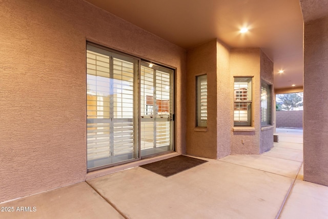 13007 W Tuckey Ct, Glendale, AZ 85307 - property entrance with stucco siding and a patio