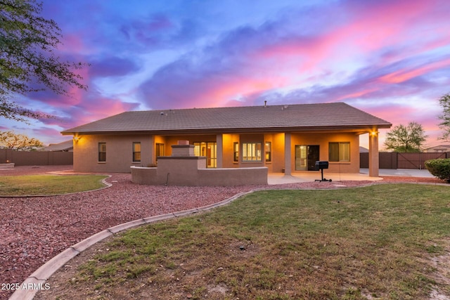 13007 W Tuckey Ct, Glendale, AZ 85307 - back of property with a tile roof, a patio area, and stucco siding