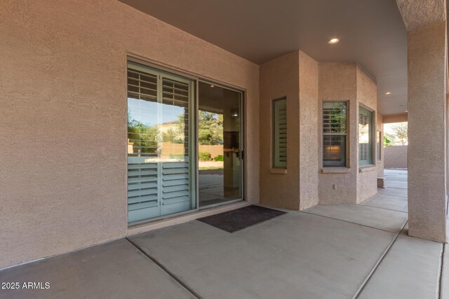 13007 W Tuckey Ct, Glendale, AZ 85307 - property entrance with stucco siding and a patio