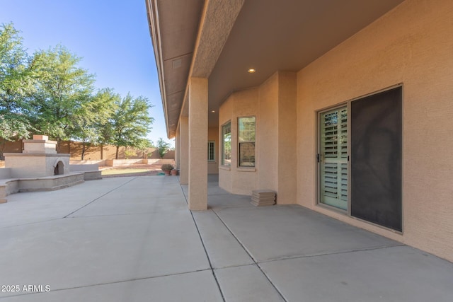 13007 W Tuckey Ct, Glendale, AZ 85307 - view of patio with an outdoor stone fireplace and fence