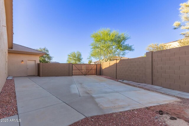 13007 W Tuckey Ct, Glendale, AZ 85307 - view of patio featuring a fenced backyard and a gate