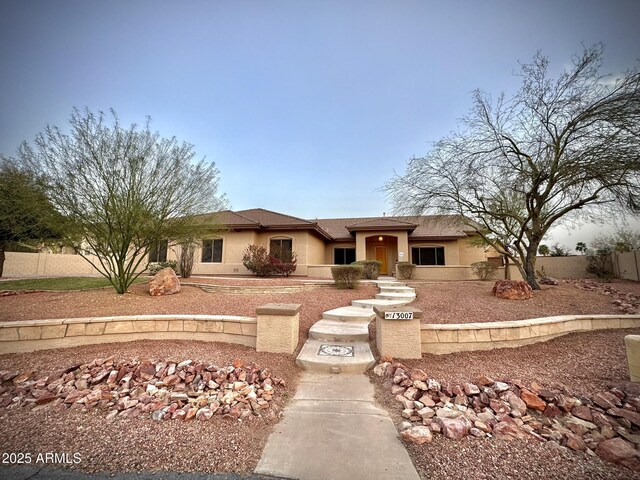 13007 W Tuckey Ct, Glendale, AZ 85307 - view of front of house featuring fence and stucco siding