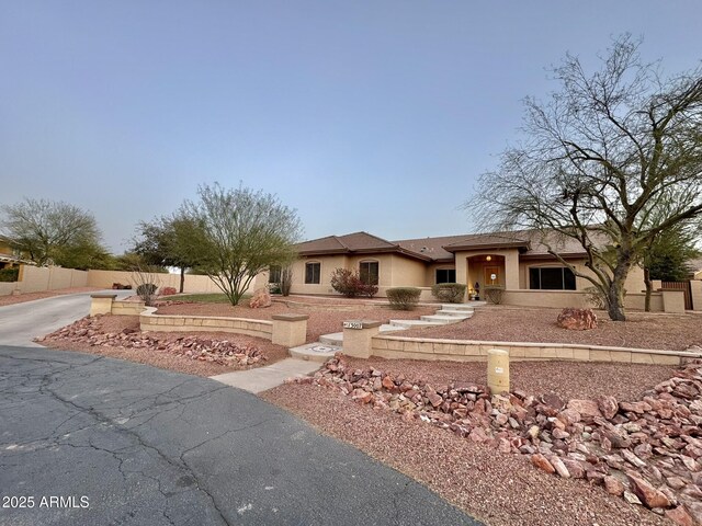 13007 W Tuckey Ct, Glendale, AZ 85307 - view of front facade with stucco siding and fence