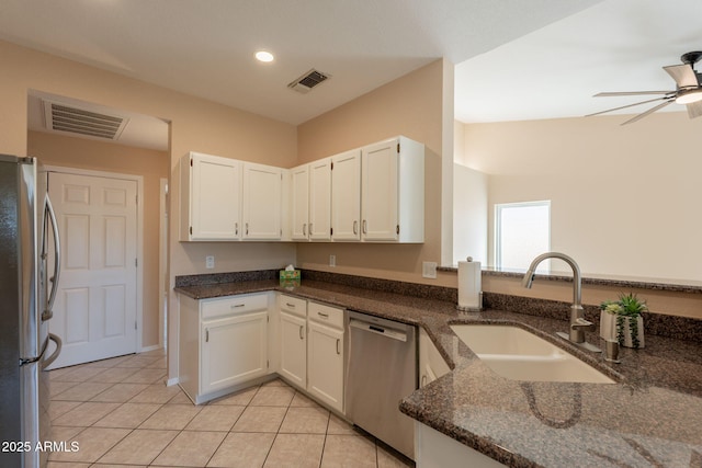 4349 W Cielo Grande, Glendale, AZ 85310 - kitchen with appliances with stainless steel finishes, a sink, dark stone countertops, a ceiling fan, and white cabinets