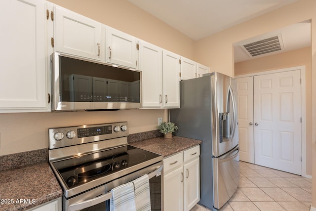 4349 W Cielo Grande, Glendale, AZ 85310 - kitchen with stainless steel appliances, white cabinetry, and light tile patterned floors