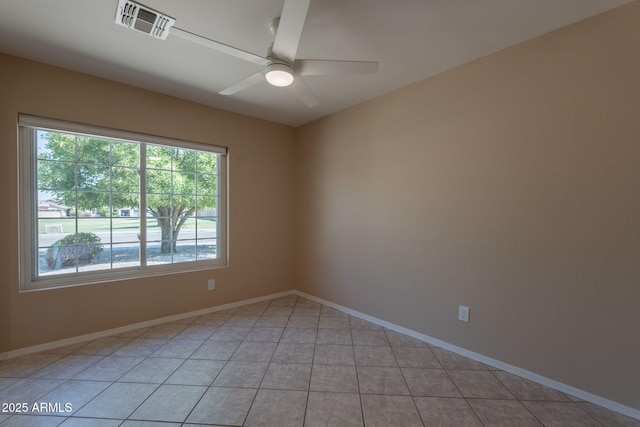 4349 W Cielo Grande, Glendale, AZ 85310 - spare room featuring a ceiling fan, baseboards, and light tile patterned floors