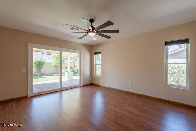 4349 W Cielo Grande, Glendale, AZ 85310 - spare room with wood finished floors, ceiling fan, and baseboards