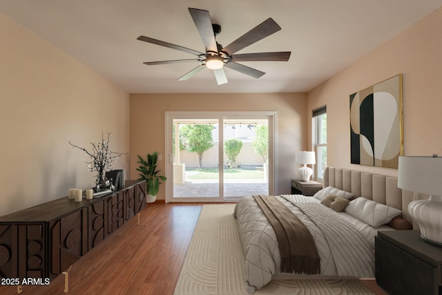 4349 W Cielo Grande, Glendale, AZ 85310 - bedroom featuring access to outside, light wood-style flooring, and ceiling fan