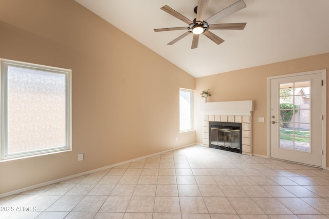 4349 W Cielo Grande, Glendale, AZ 85310 - unfurnished living room with a tile fireplace, a ceiling fan, high vaulted ceiling, and baseboards