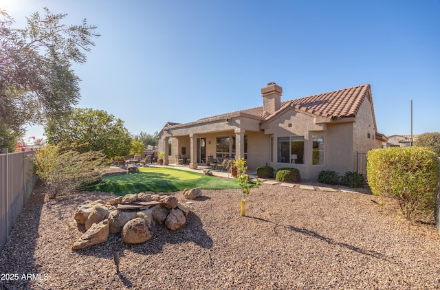 rear view of property featuring a patio area