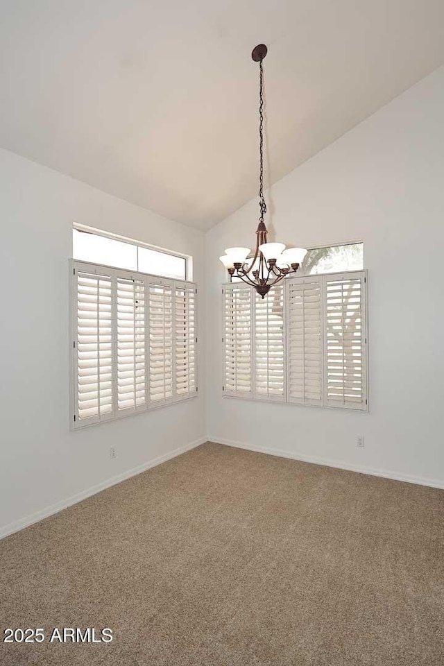 14833 S 14th Pl, Phoenix, AZ 85048 - empty room featuring baseboards, carpet flooring, a chandelier, and vaulted ceiling