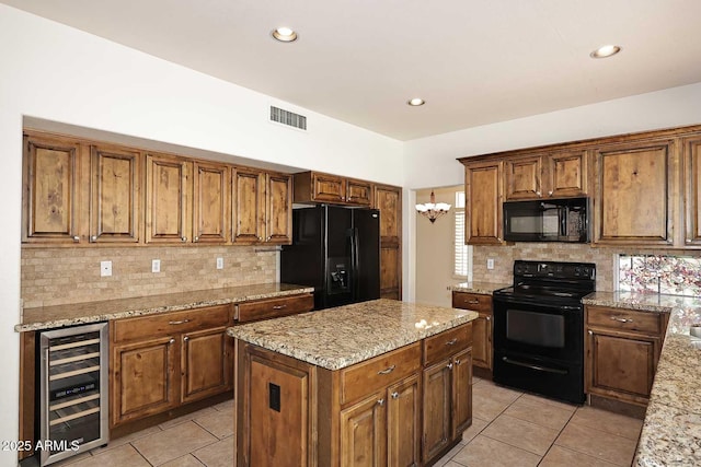 14833 S 14th Pl, Phoenix, AZ 85048 - kitchen featuring beverage cooler, light tile patterned floors, tasteful backsplash, visible vents, and black appliances