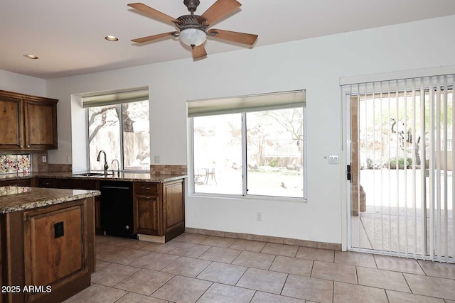 14833 S 14th Pl, Phoenix, AZ 85048 - kitchen with black dishwasher, ceiling fan, a sink, and a healthy amount of sunlight