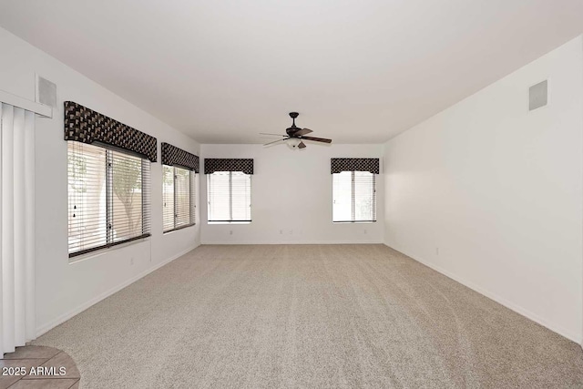 14833 S 14th Pl, Phoenix, AZ 85048 - spare room with light colored carpet, baseboards, and ceiling fan