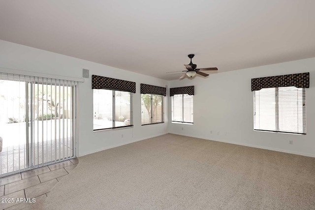 14833 S 14th Pl, Phoenix, AZ 85048 - spare room featuring baseboards, a ceiling fan, and light carpet