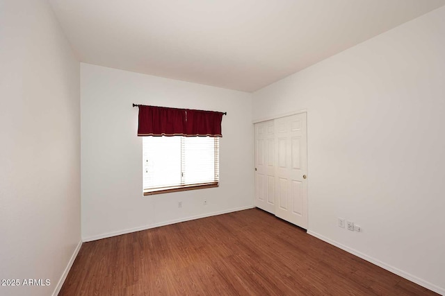 14833 S 14th Pl, Phoenix, AZ 85048 - spare room with dark wood-type flooring and baseboards