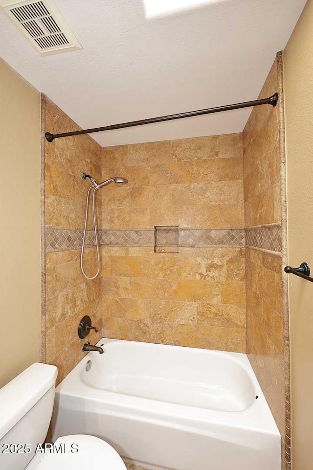 14833 S 14th Pl, Phoenix, AZ 85048 - full bathroom featuring visible vents, shower / tub combination, and toilet