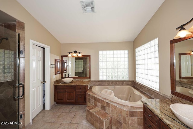 14833 S 14th Pl, Phoenix, AZ 85048 - full bath featuring visible vents, lofted ceiling, a bath, two vanities, and a stall shower