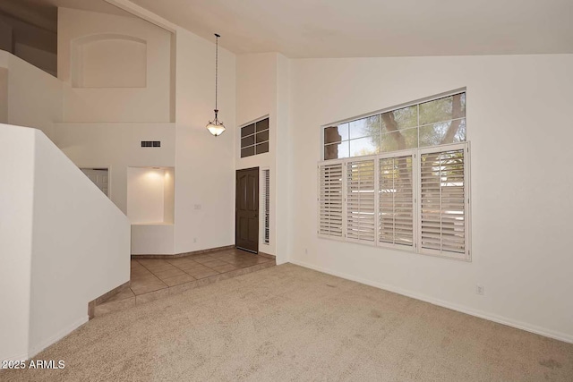 14833 S 14th Pl, Phoenix, AZ 85048 - unfurnished living room with baseboards, carpet flooring, high vaulted ceiling, and visible vents