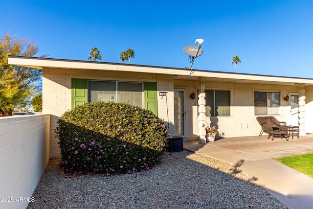 ranch-style house featuring a patio