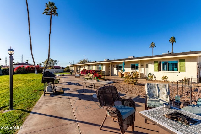 exterior space featuring a lawn and a patio