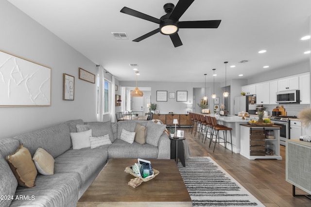 5871 N 187th Ln, Litchfield Park, AZ 85340 - living room with a ceiling fan, dark wood-style floors, and recessed lighting