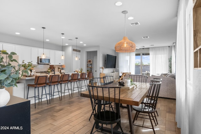 5871 N 187th Ln, Litchfield Park, AZ 85340 - dining area featuring light wood finished floors and recessed lighting