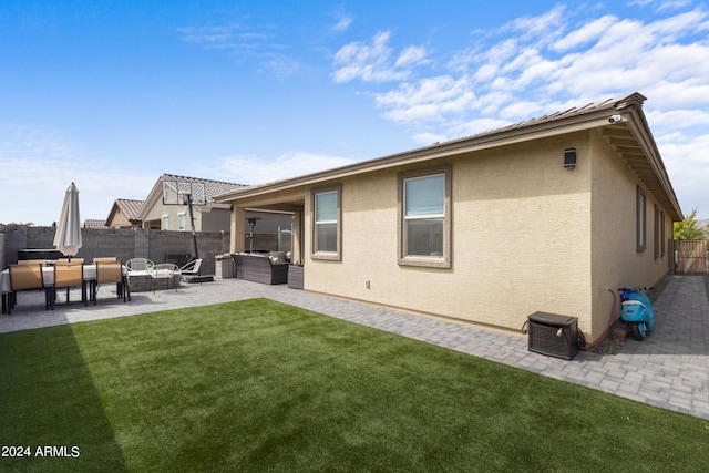 5871 N 187th Ln, Litchfield Park, AZ 85340 - rear view of house with stucco siding, an outdoor living space, and a patio area