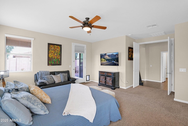 bedroom with carpet flooring, ceiling fan, visible vents, and baseboards