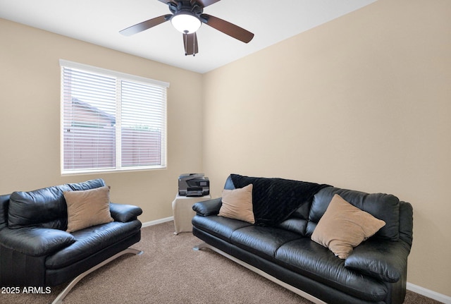 living room with carpet floors, ceiling fan, and baseboards