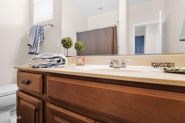 full bath with toilet and vanity