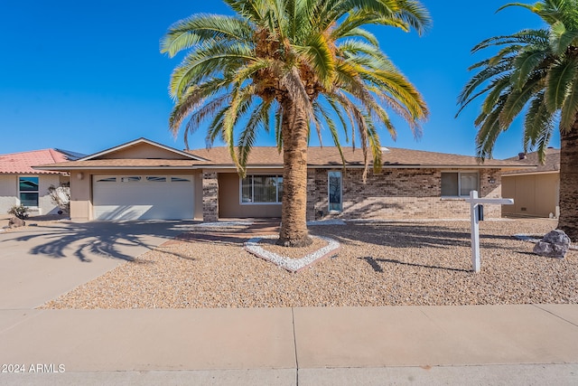 ranch-style home with a garage