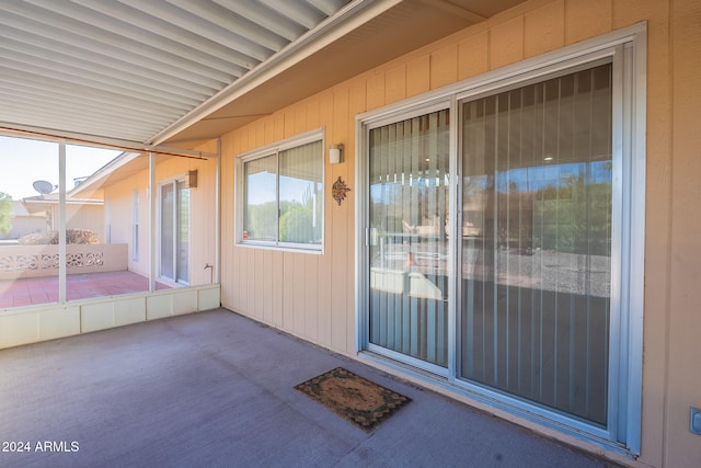 doorway to property with a patio