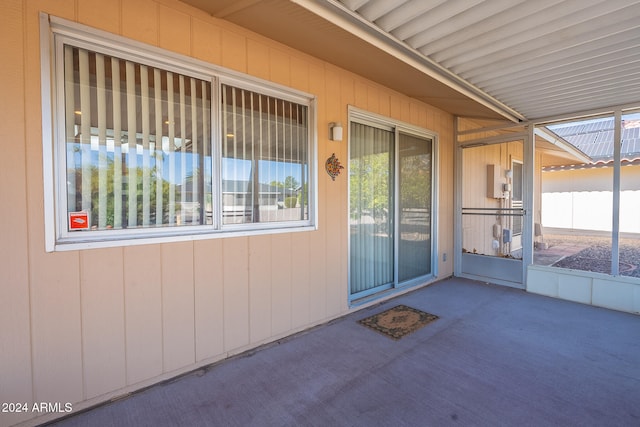 entrance to property featuring a patio